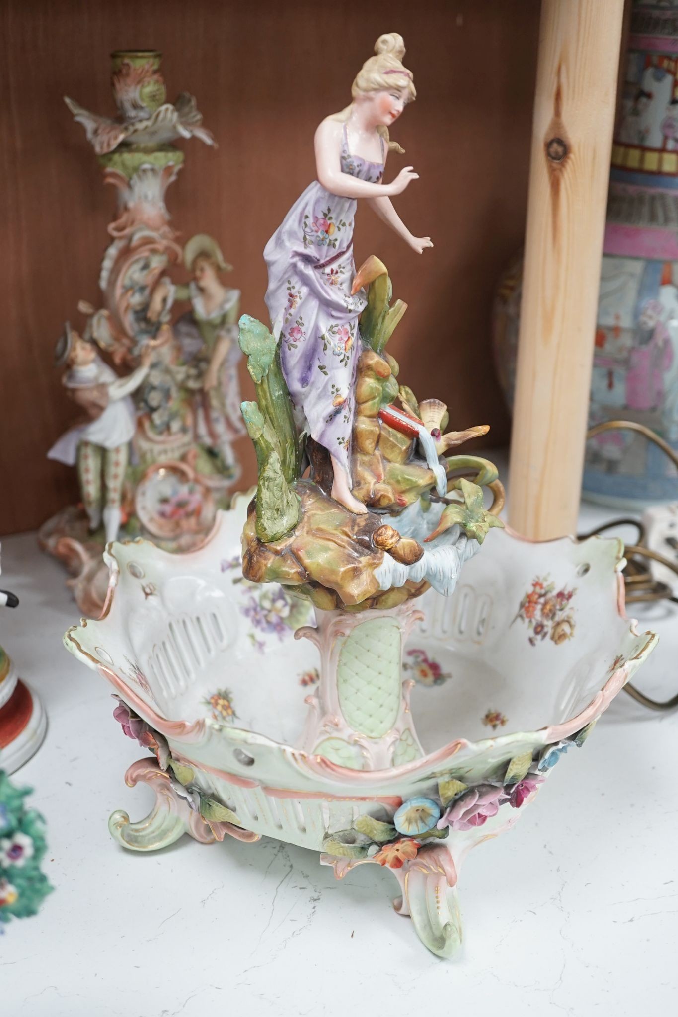 A quantity of various ceramic figures including two Doulton 'Valerie' and 'Meg', tallest figurative candlesticks 34 cms high.